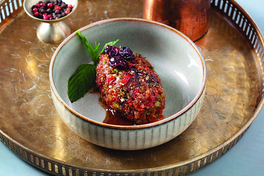 Meze in Ottoman Cuisine: Cold Starters at Deraliye 2 Deraliye Restaurant - acili ezme spicy pepper meze on a brass tray
