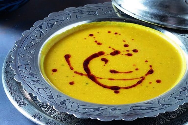 Deraliye Restaurant - lentil soup with spiced butter in a silver bowl